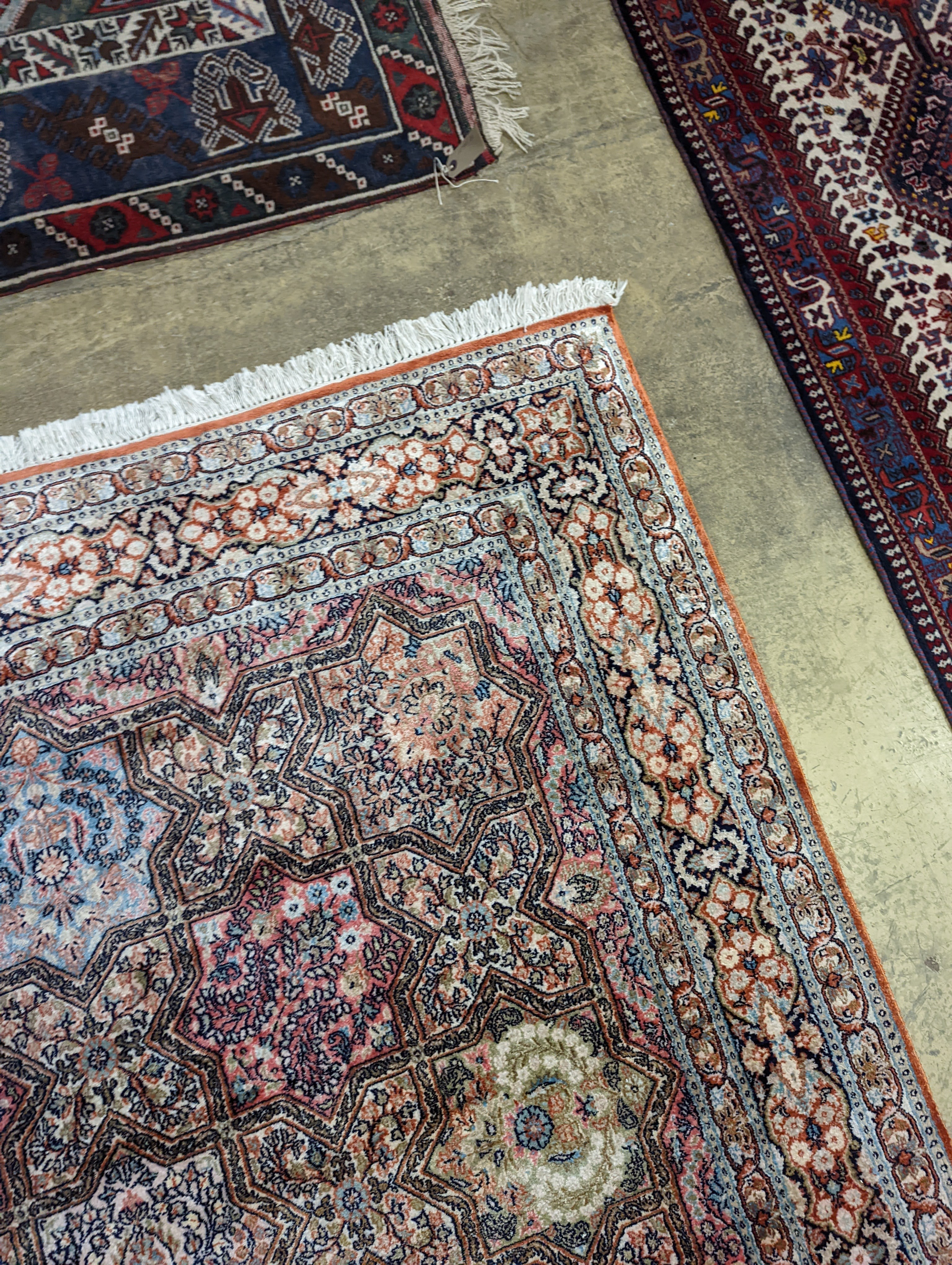 Two Turkish rugs and a Persian rugs. Largest, 284x172cm.